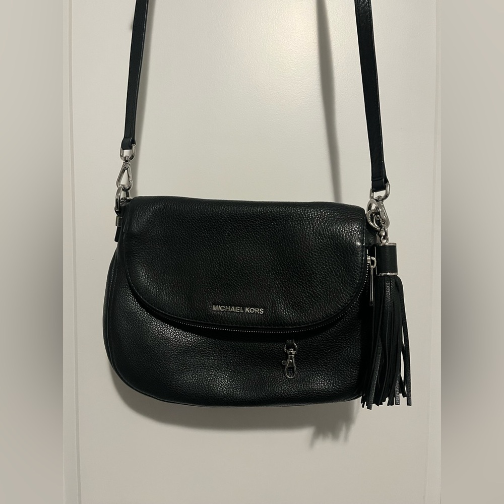 Michael Kors Black Shoulder Bag with Tassel Silver hardware. Good condition.